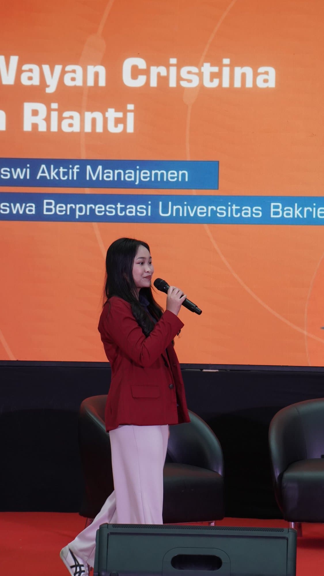 Welcoming academic leaders and guest delegates at formal management symposium.